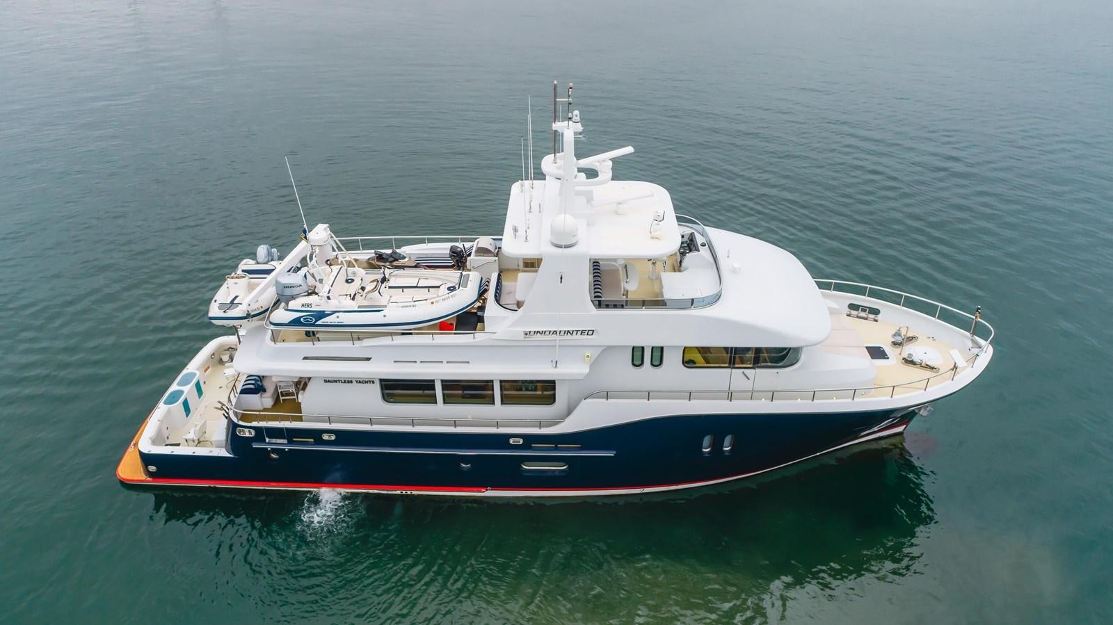a boat in the water aboard UNDAUNTED Yacht for Sale