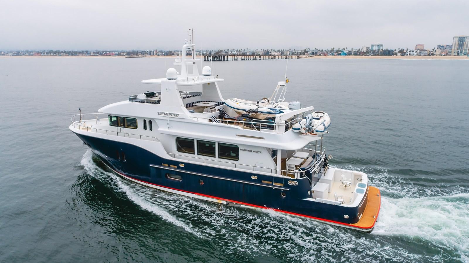 a boat on the water aboard UNDAUNTED Yacht for Sale