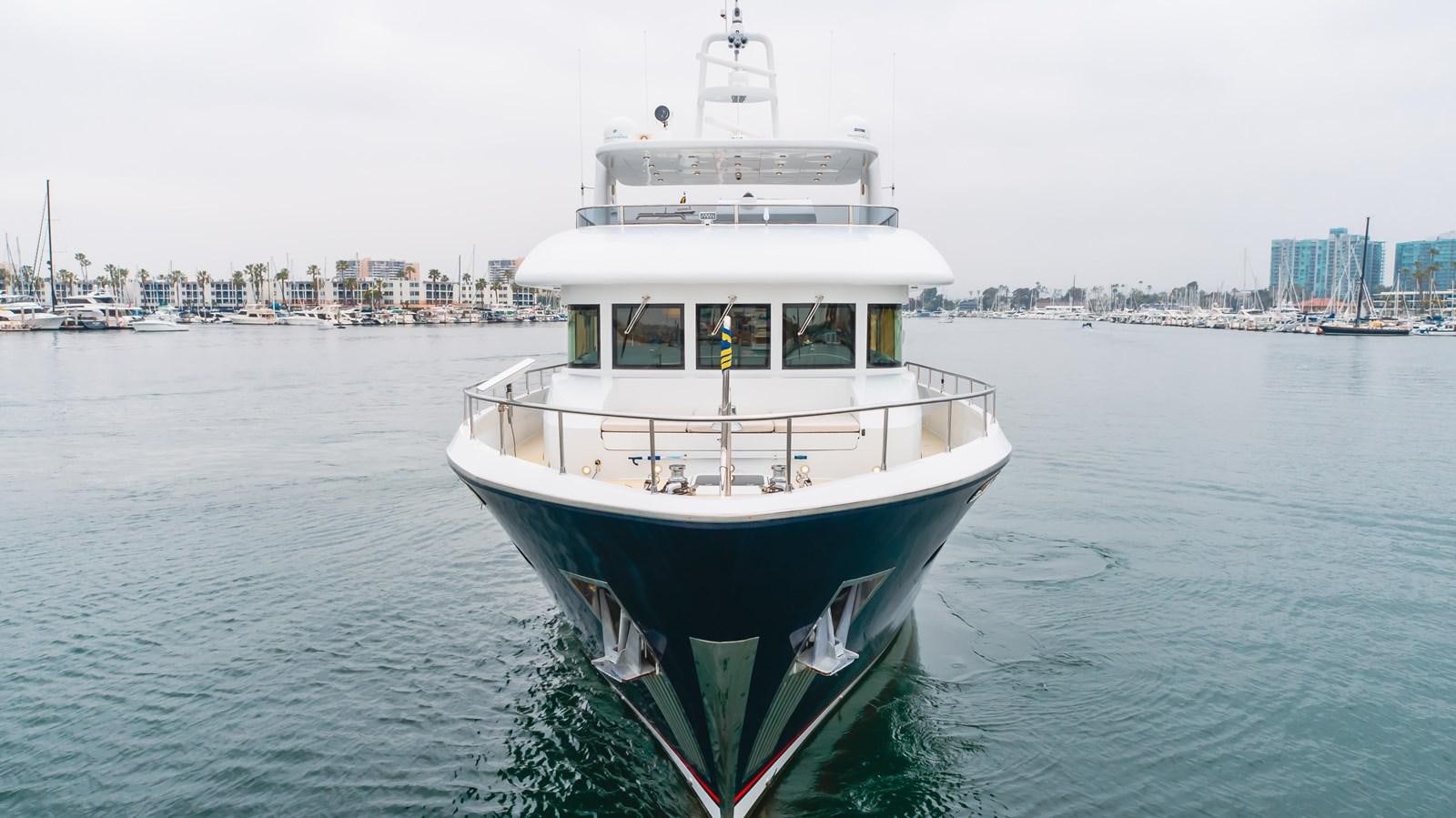 a large boat in the water aboard UNDAUNTED Yacht for Sale