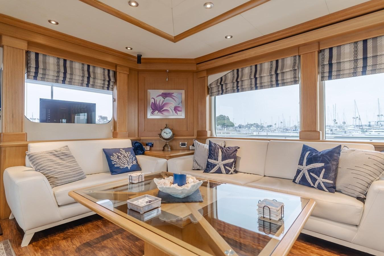 a living room with a large window aboard UNDAUNTED Yacht for Sale