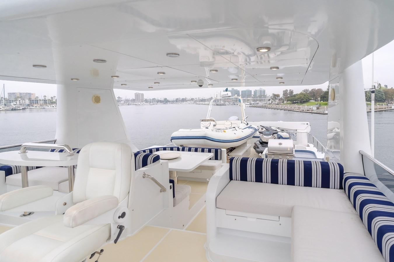 a room with a view of a city and a body of water aboard UNDAUNTED Yacht for Sale