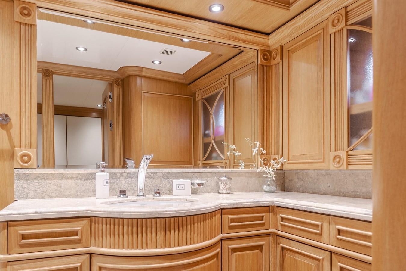 a bathroom with a large mirror aboard UNDAUNTED Yacht for Sale