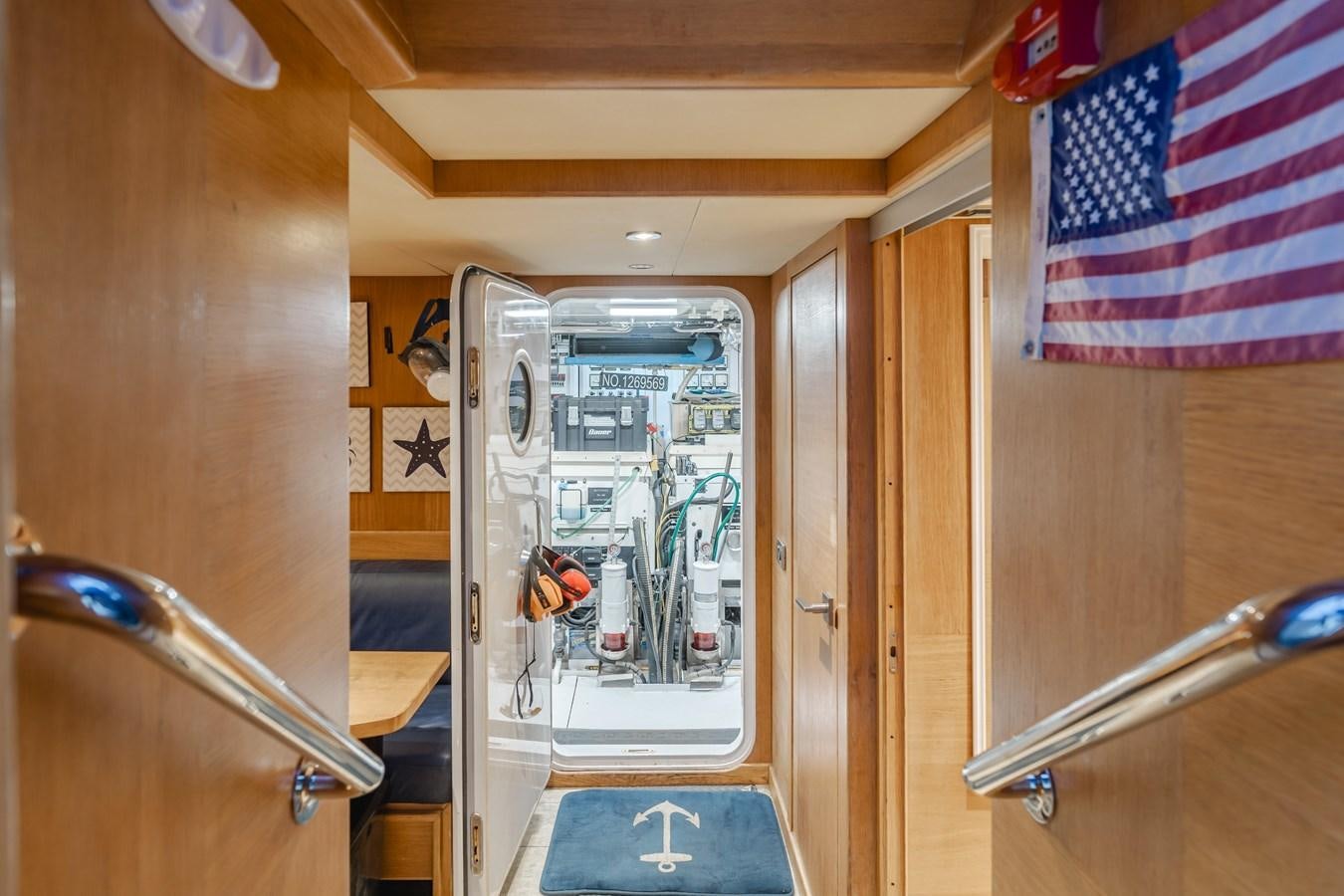 a door with a flag on the door aboard UNDAUNTED Yacht for Sale