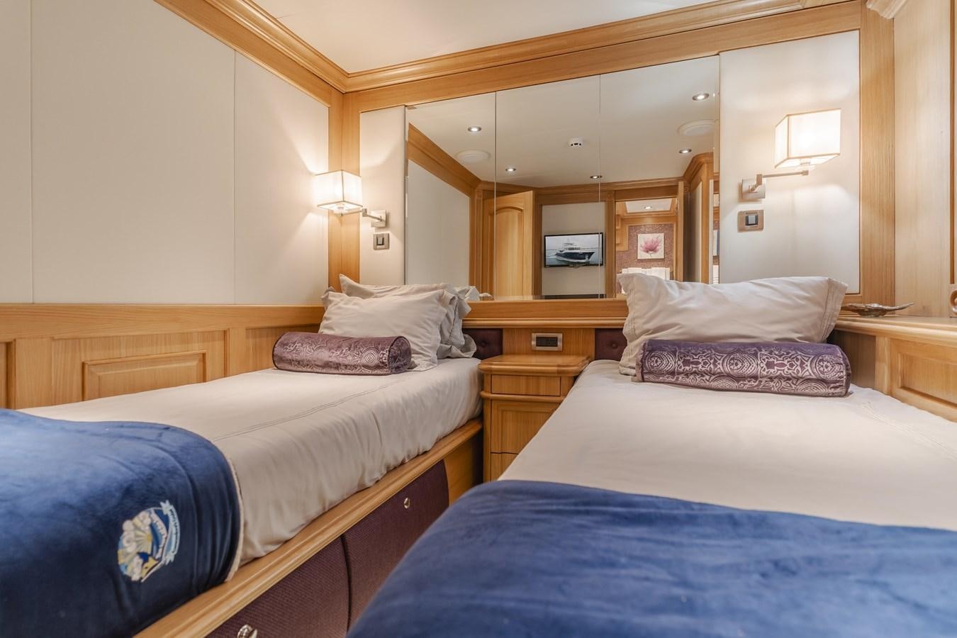 a couple of beds in a hotel room aboard UNDAUNTED Yacht for Sale