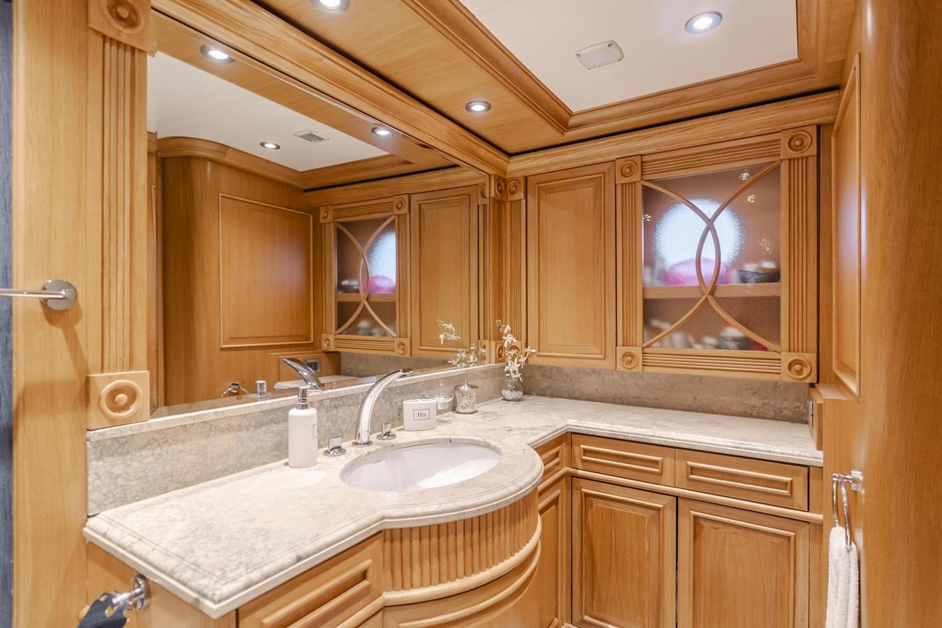 a bathroom with a large mirror aboard UNDAUNTED Yacht for Sale