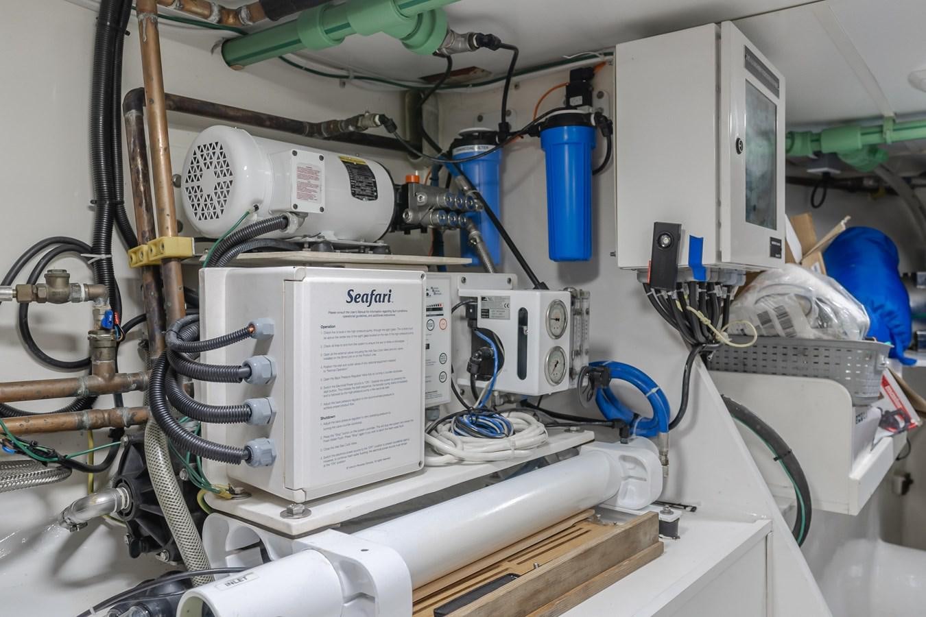a machine with wires and a blue container aboard UNDAUNTED Yacht for Sale