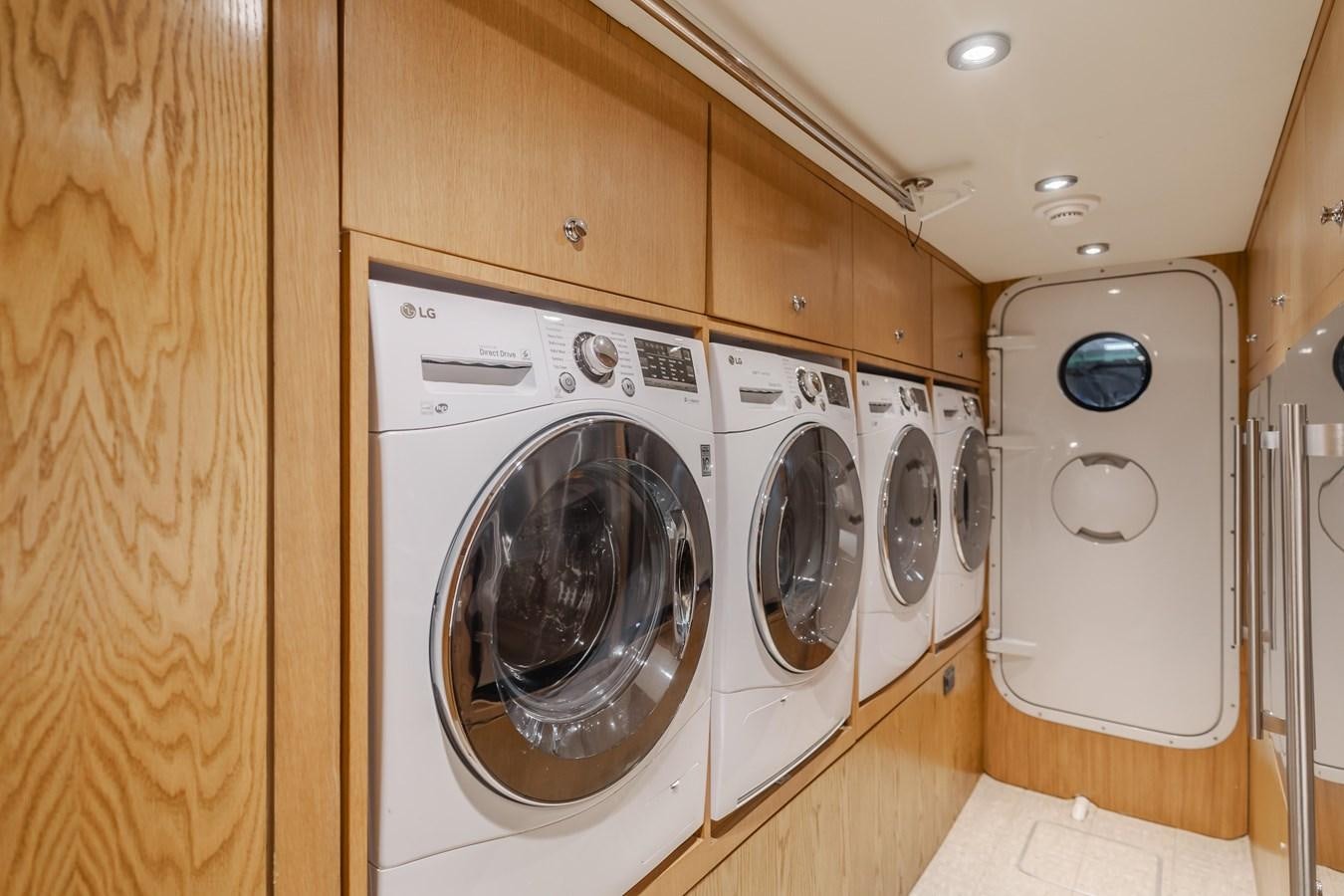 a row of washing machines aboard UNDAUNTED Yacht for Sale