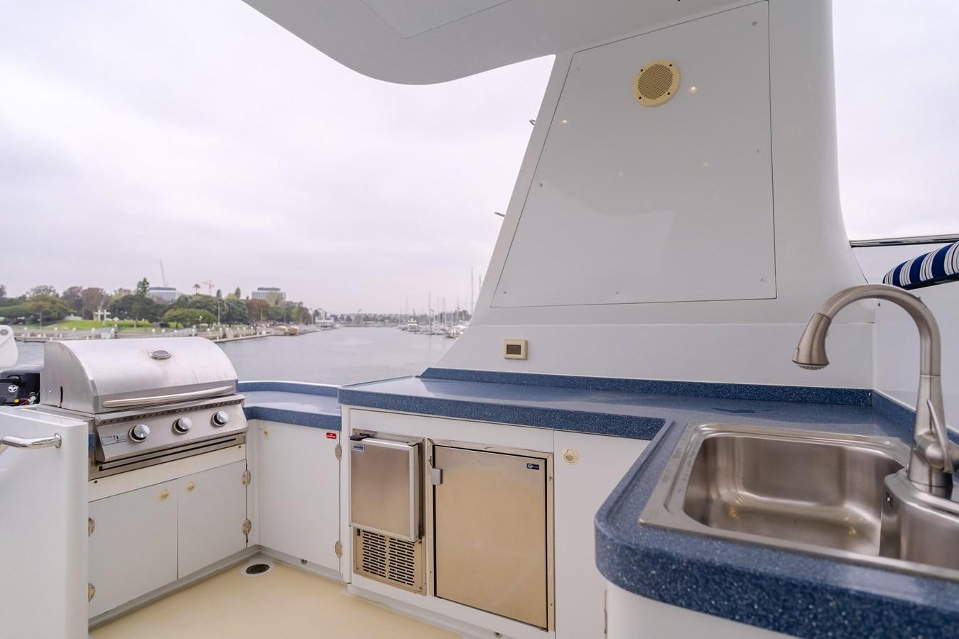 a white boat with a sink and a stove aboard UNDAUNTED Yacht for Sale