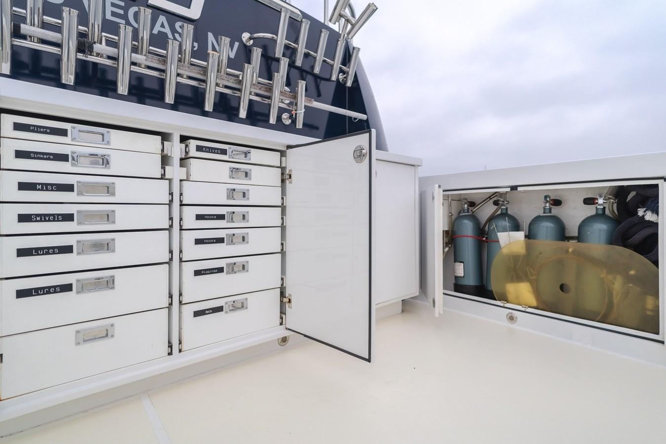 a room with a cabinet and shelves aboard UNDAUNTED Yacht for Sale