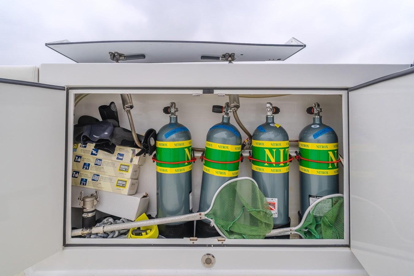 a refrigerator with several bottles of liquid aboard UNDAUNTED Yacht for Sale