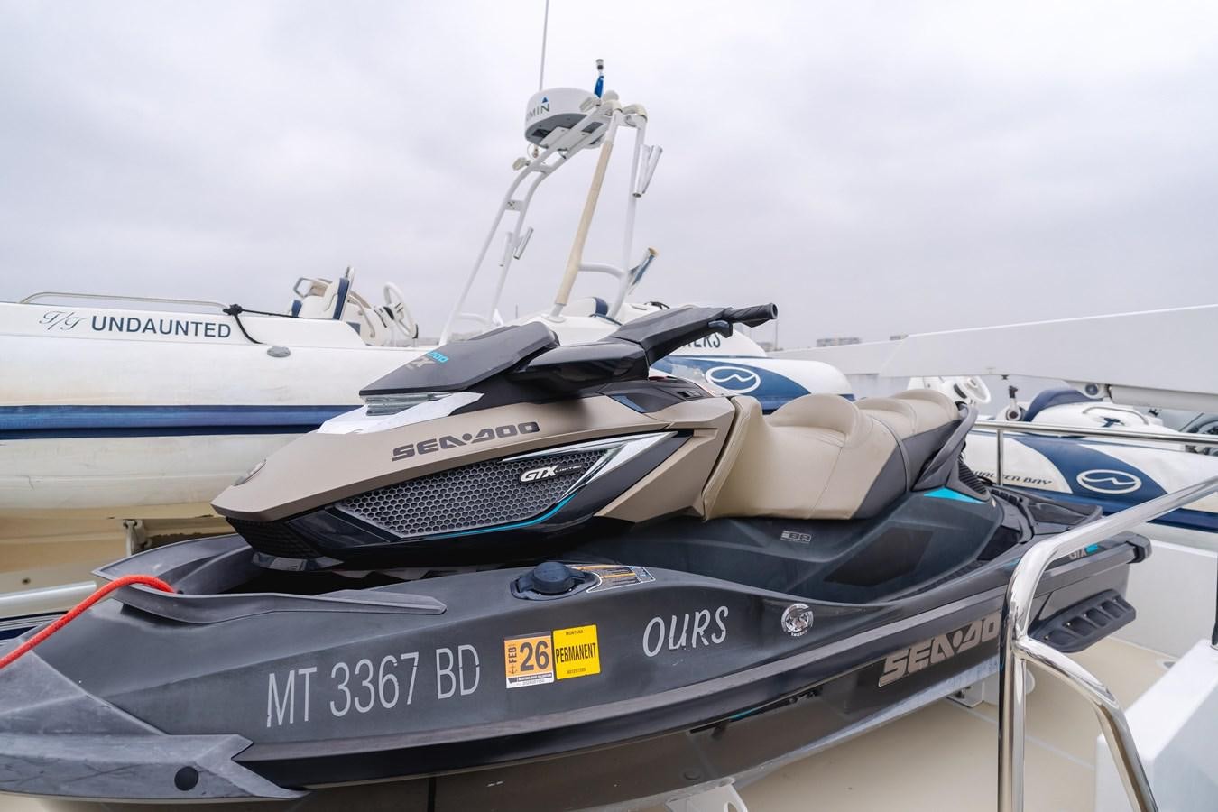 a row of boats on a dock aboard UNDAUNTED Yacht for Sale