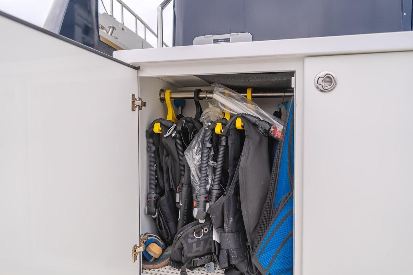 a closet full of clothes aboard UNDAUNTED Yacht for Sale