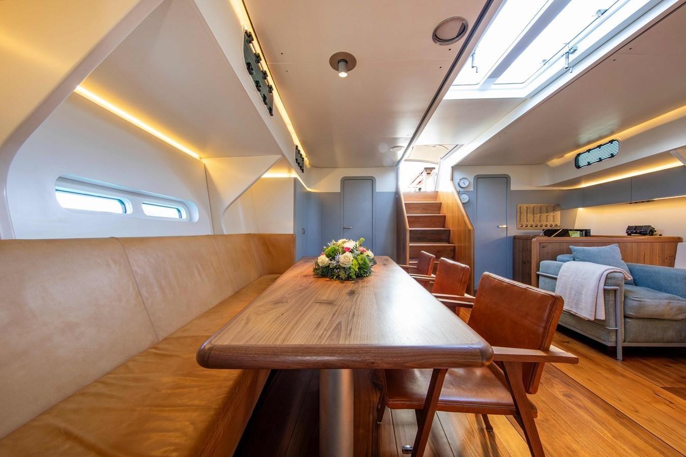 a room with a table and chairs aboard PEREGRIN Yacht for Sale