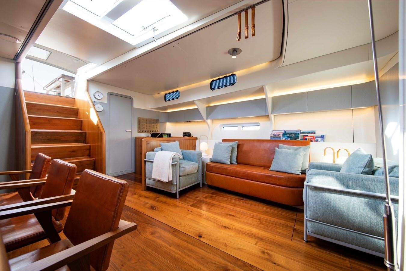 a living room with a wood floor aboard PEREGRIN Yacht for Sale