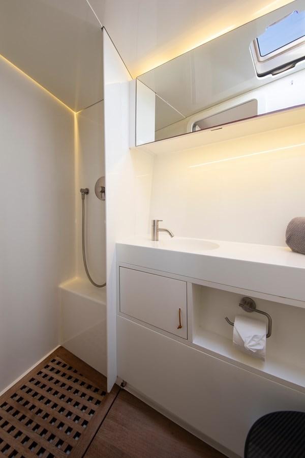 a bathroom with a sink and a mirror aboard PEREGRIN Yacht for Sale