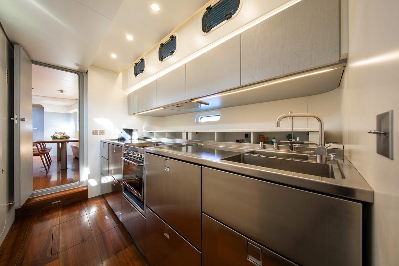 a kitchen with a sink and a stove aboard PEREGRIN Yacht for Sale