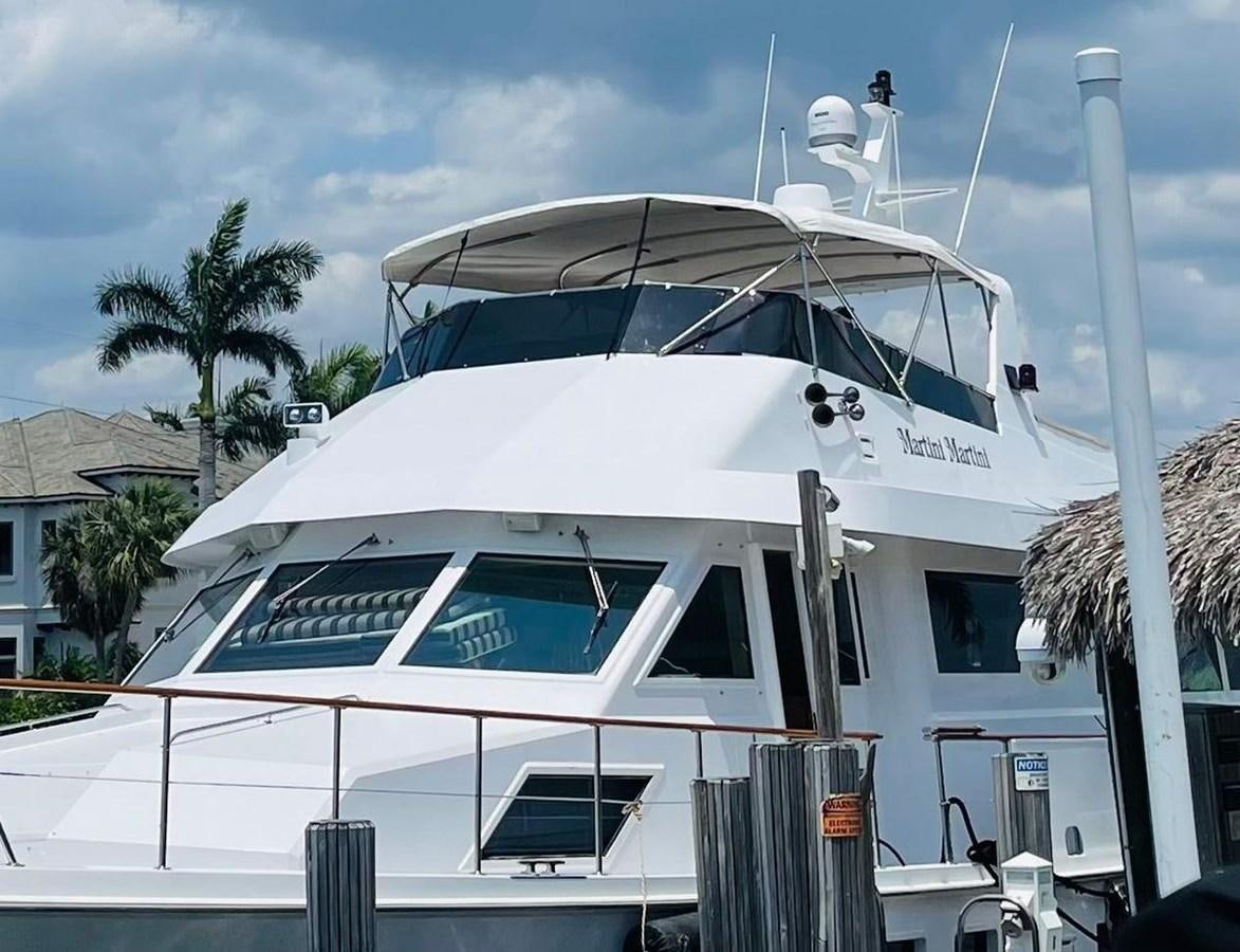 a white boat with a white roof aboard MARTINI MARTINI Yacht for Sale