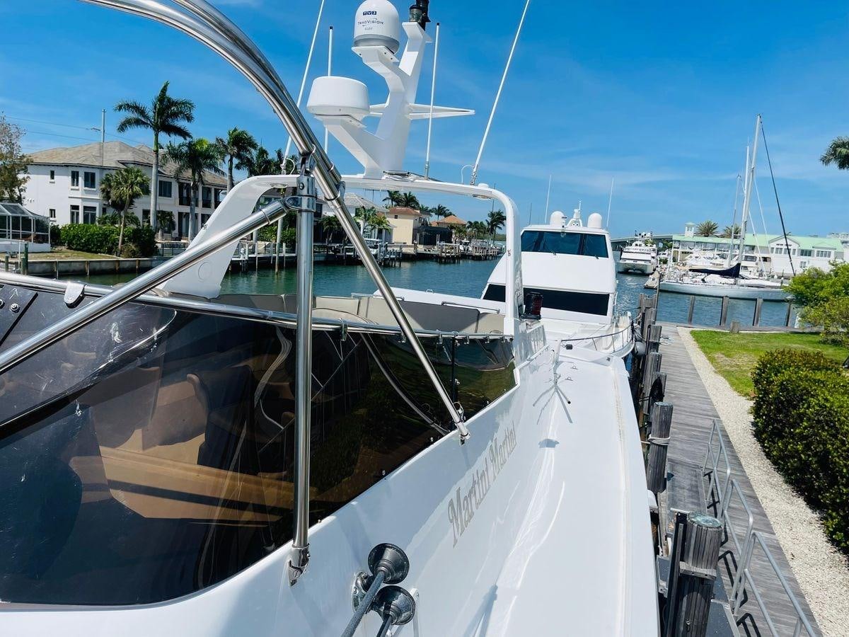 a boat parked on the side of a road aboard MARTINI MARTINI Yacht for Sale