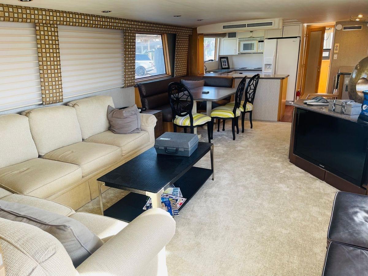 a living room with a couch and a television aboard MARTINI MARTINI Yacht for Sale