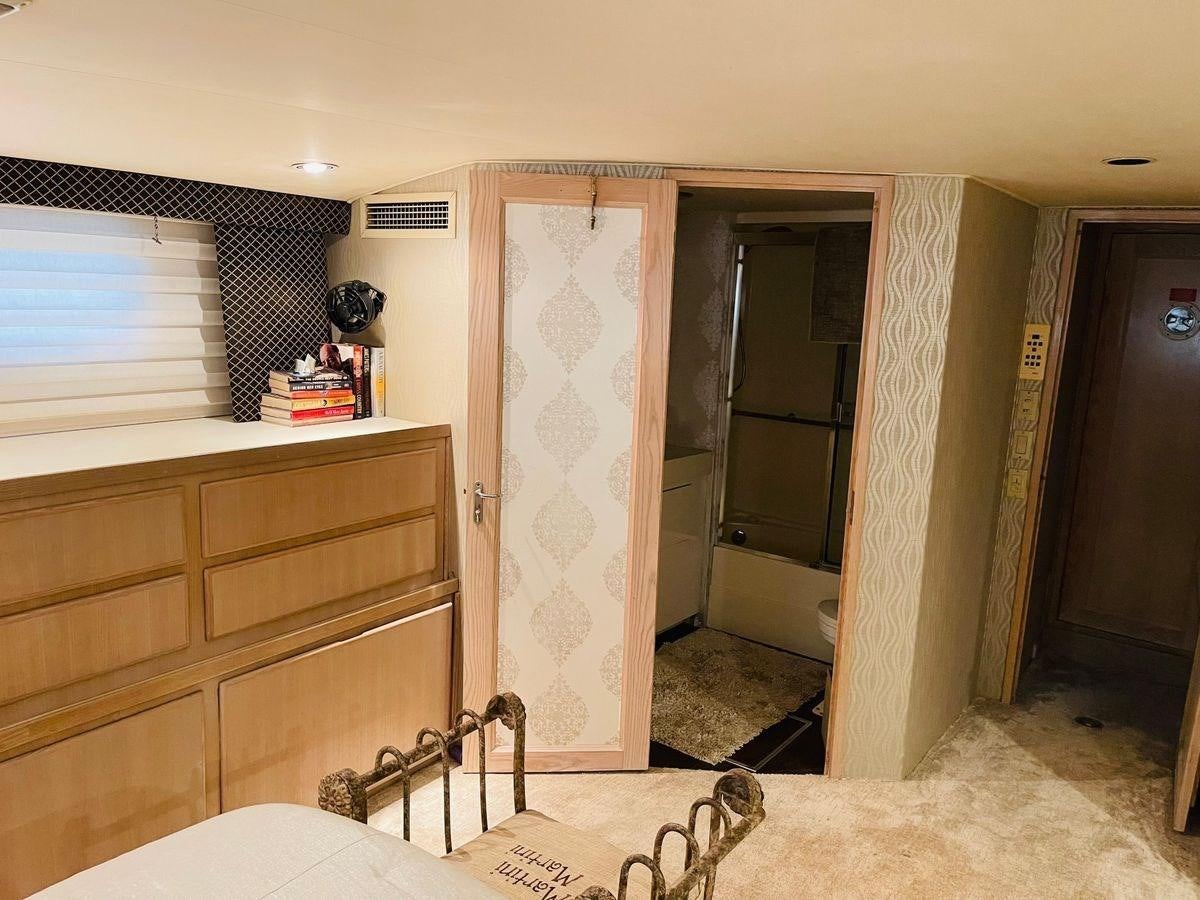 a room with a dresser and a mirror aboard MARTINI MARTINI Yacht for Sale