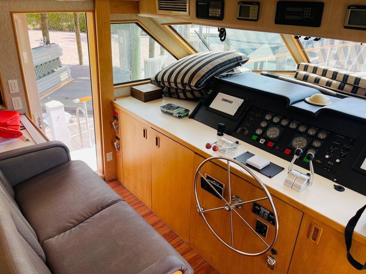 a room with a bed and a desk with a fan and a couch aboard MARTINI MARTINI Yacht for Sale