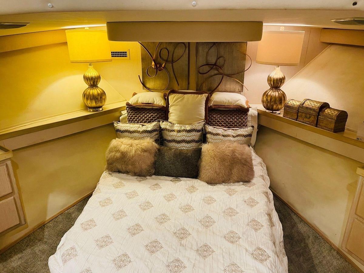 a bed with pillows and pillows aboard MARTINI MARTINI Yacht for Sale