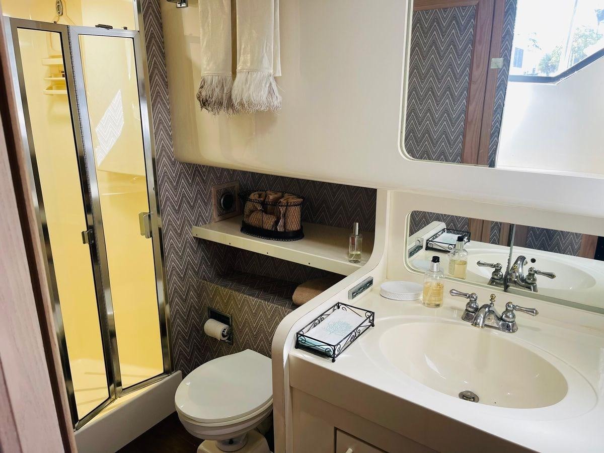 a bathroom with a sink and toilet aboard MARTINI MARTINI Yacht for Sale