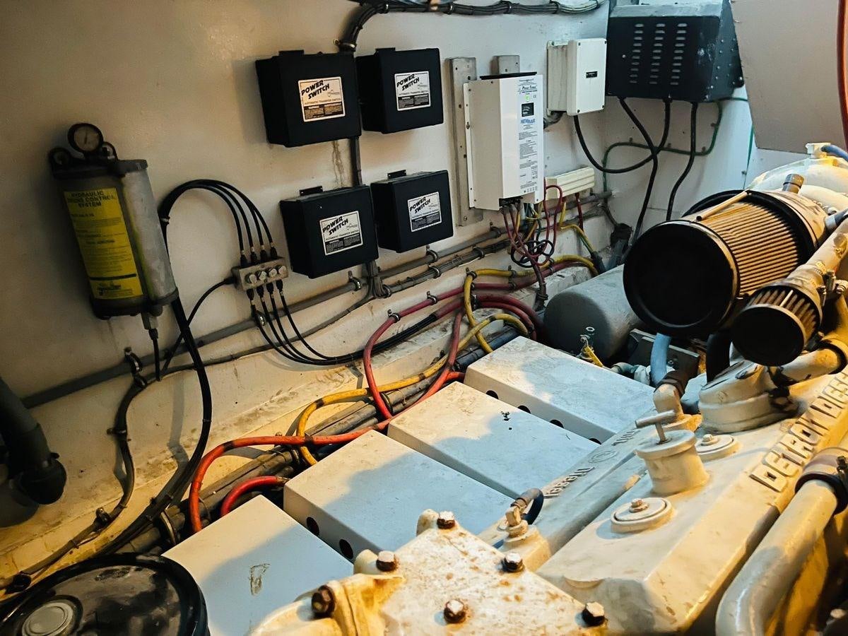 a cluttered desk with electronics aboard MARTINI MARTINI Yacht for Sale