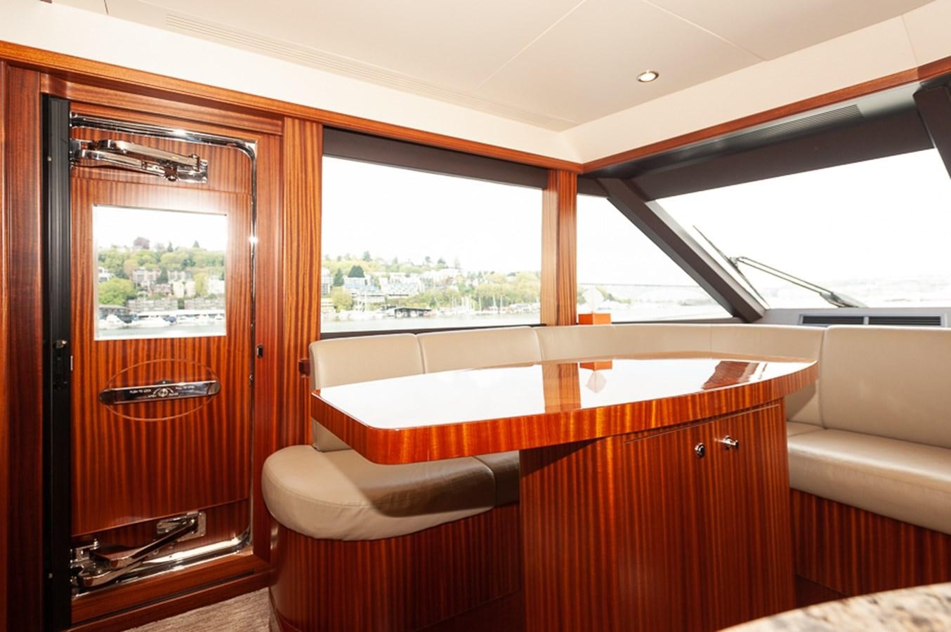 a room with a bed and a window aboard FOREVER INTREPID Yacht for Sale