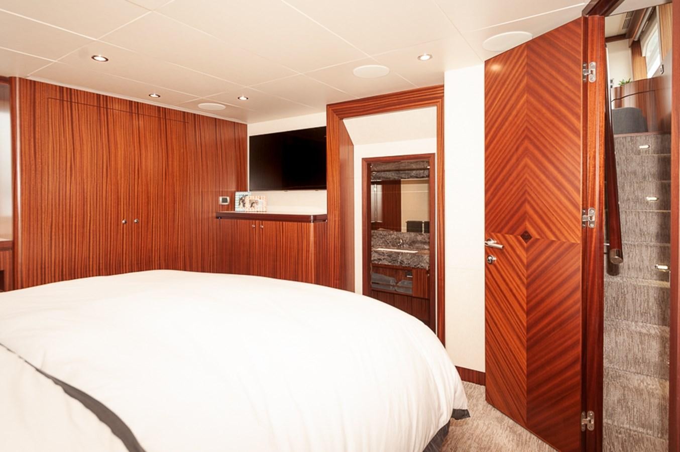 a bed in a room aboard FOREVER INTREPID Yacht for Sale