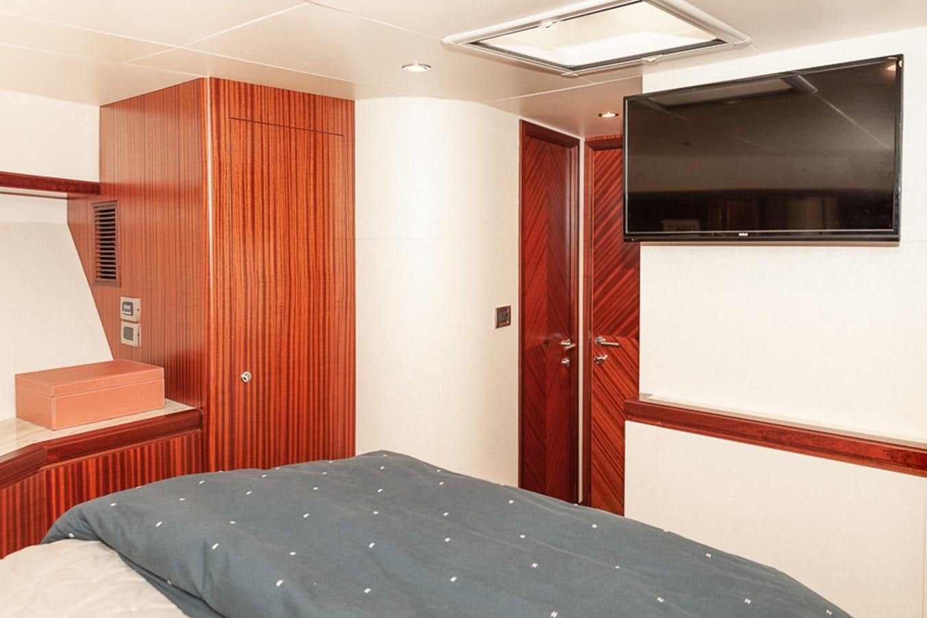 a bed in a room aboard FOREVER INTREPID Yacht for Sale