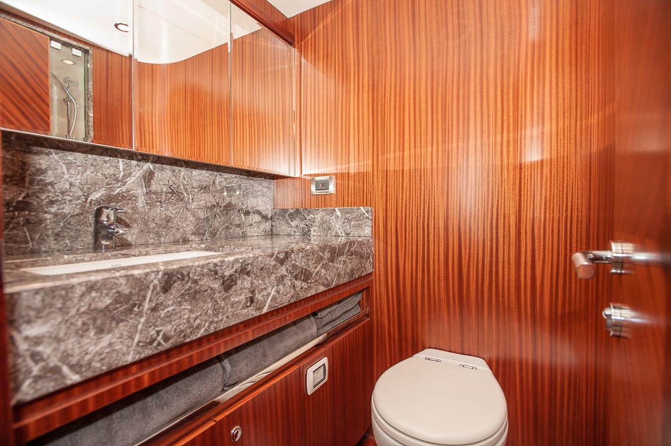 a bathroom with a marble counter aboard FOREVER INTREPID Yacht for Sale