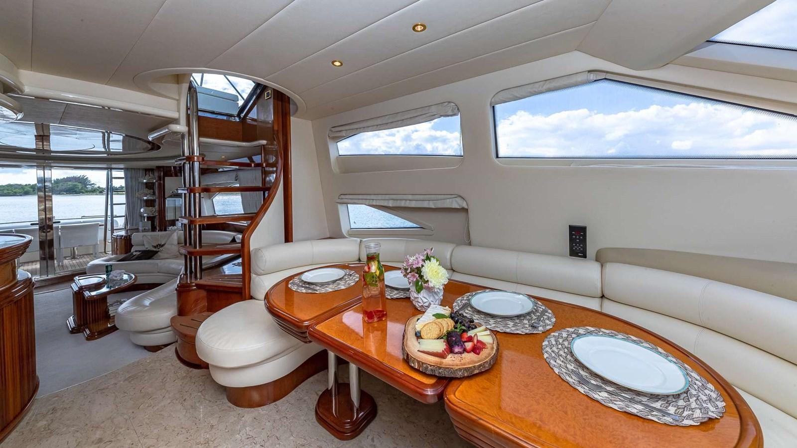a room with a table and chairs aboard SALT SHAKER Yacht for Sale