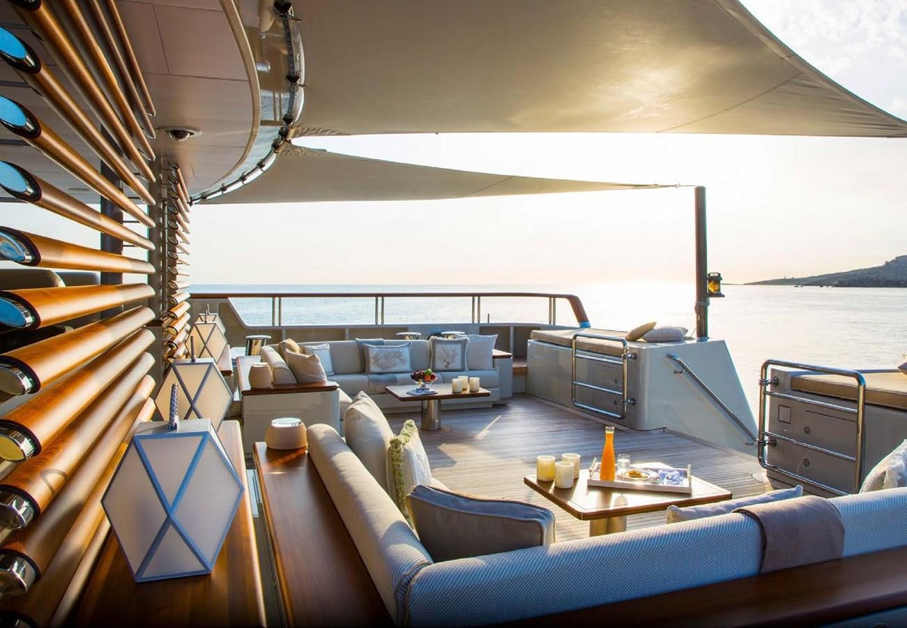 a living room with a large balcony aboard POLAR STAR Yacht for Sale