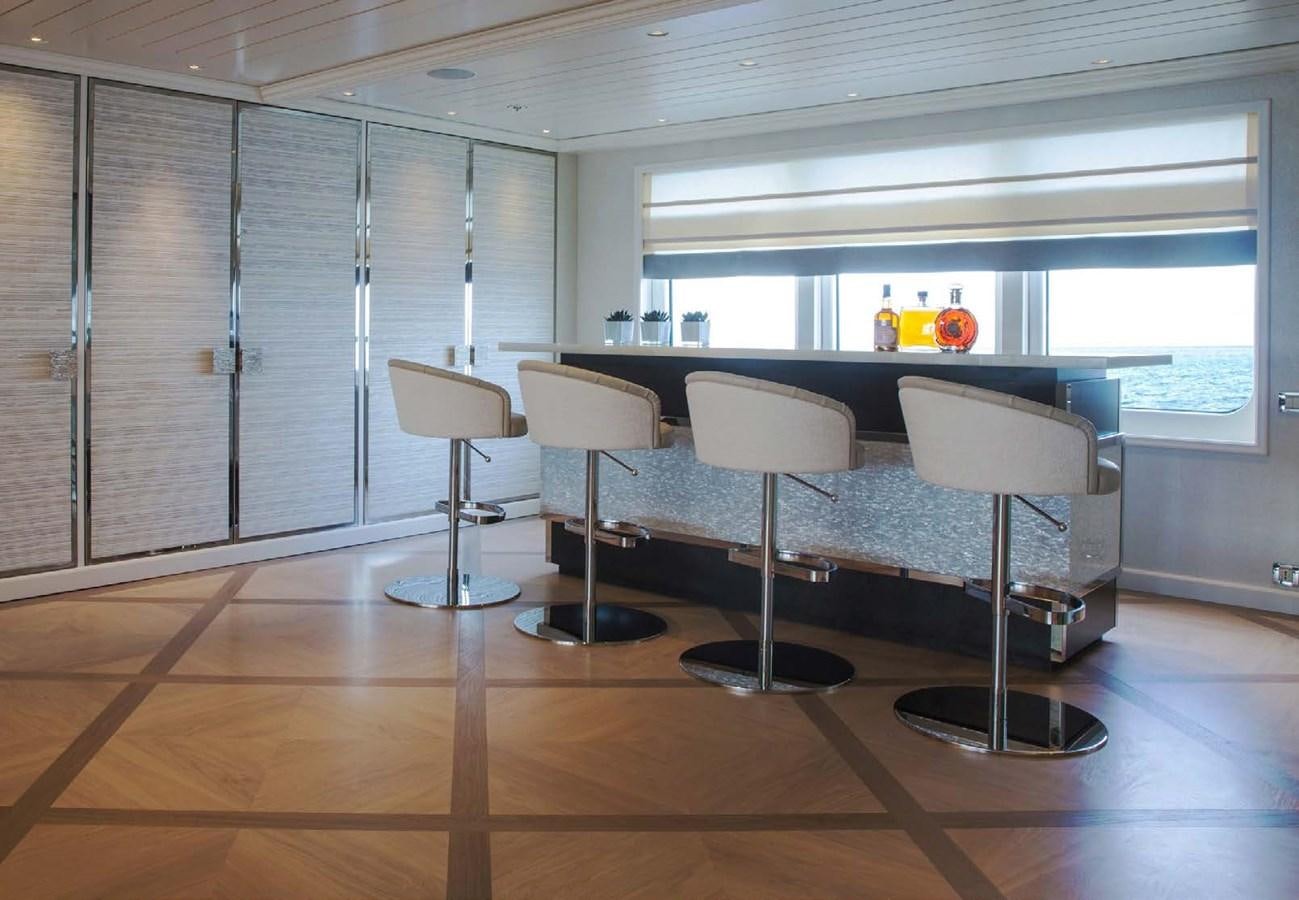 a room with chairs and a table aboard POLAR STAR Yacht for Sale