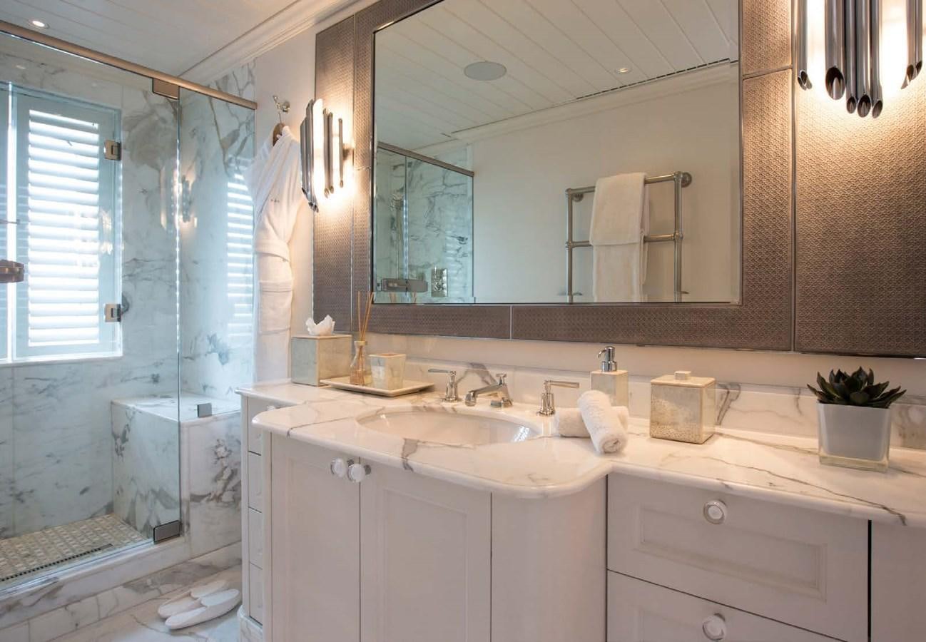 a bathroom with a large mirror aboard POLAR STAR Yacht for Sale