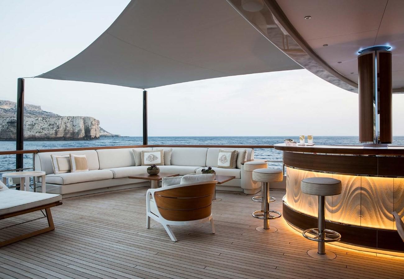 a room with a couch and tables aboard POLAR STAR Yacht for Sale