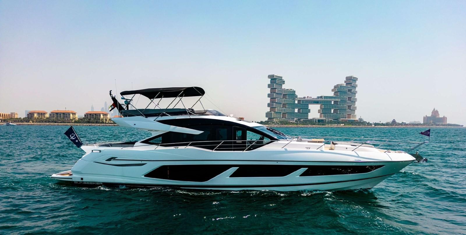 a boat in the water aboard 2023 SUNSEEKER 65 SPORT Yacht for Sale
