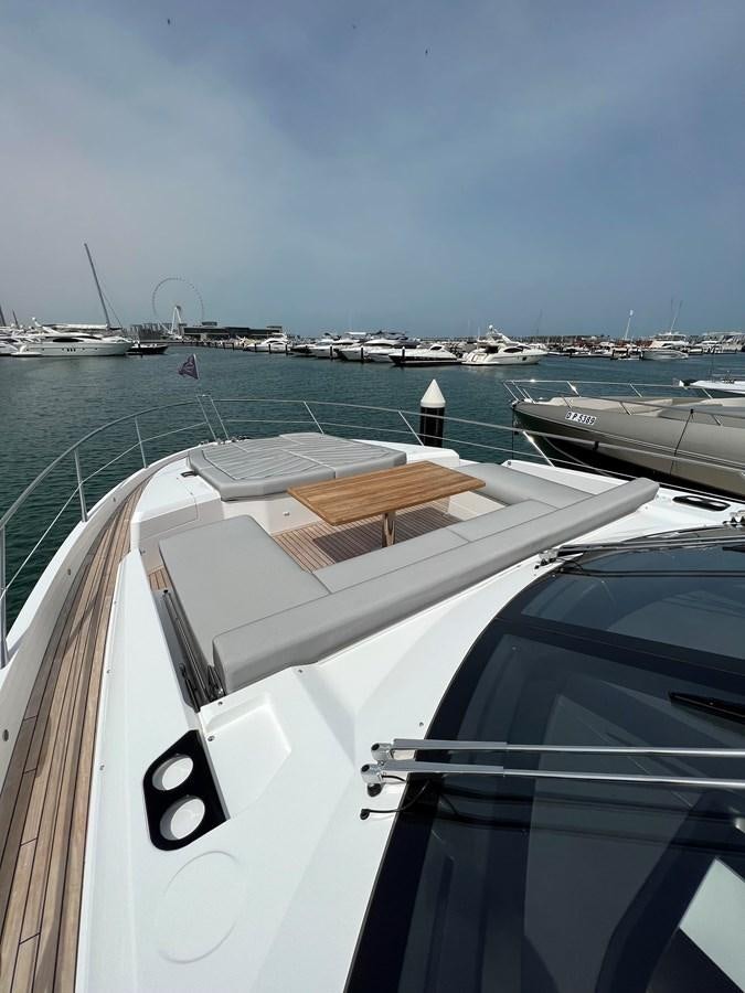 a boat on the water aboard 2023 SUNSEEKER 65 SPORT Yacht for Sale