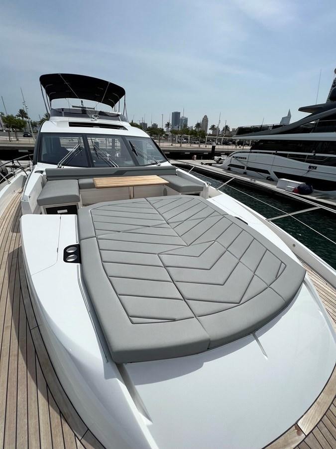 a boat parked in a harbor aboard 2023 SUNSEEKER 65 SPORT Yacht for Sale