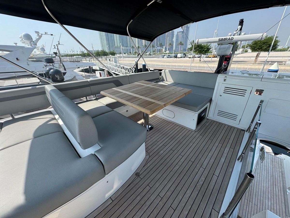 a chair on a deck aboard 2023 SUNSEEKER 65 SPORT Yacht for Sale