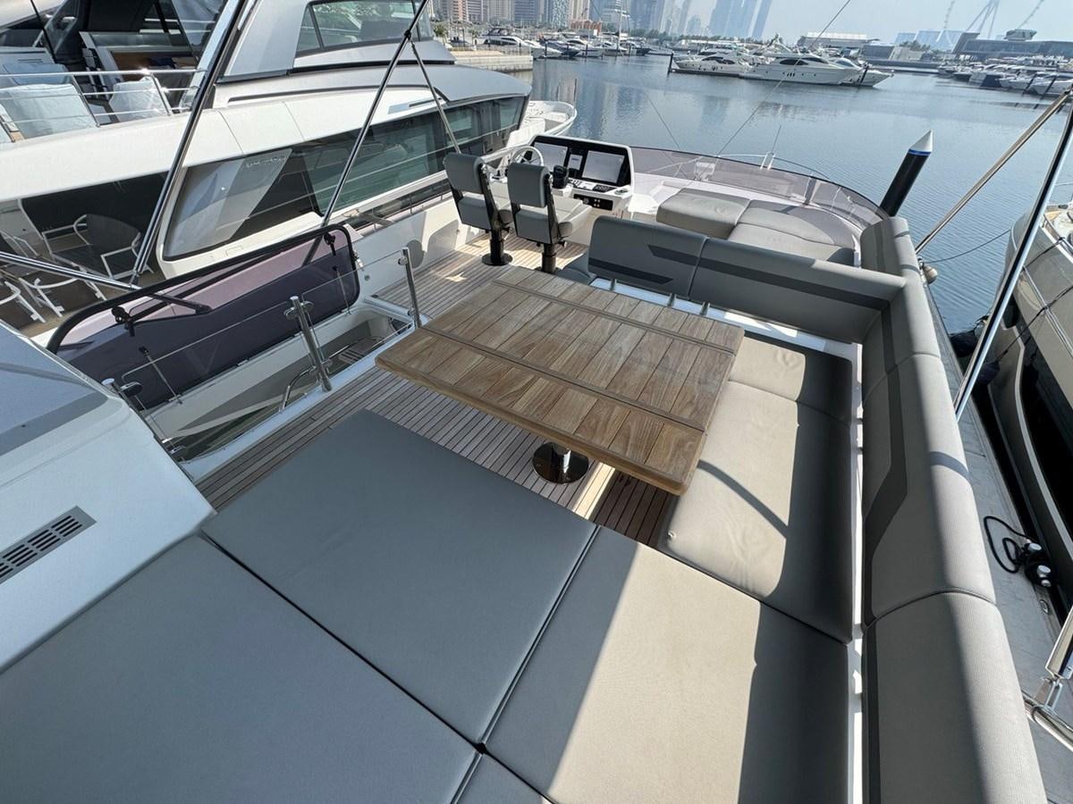 a deck with a boat on it aboard 2023 SUNSEEKER 65 SPORT Yacht for Sale