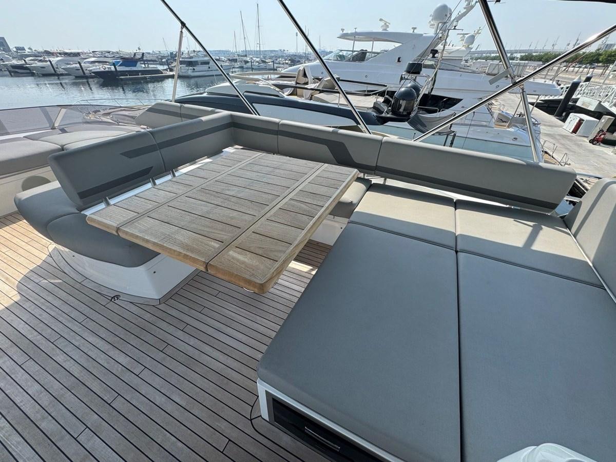 a deck with a boat and a dock aboard 2023 SUNSEEKER 65 SPORT Yacht for Sale