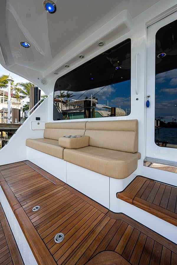 a living room with a large window aboard INSTIGATOR Yacht for Sale