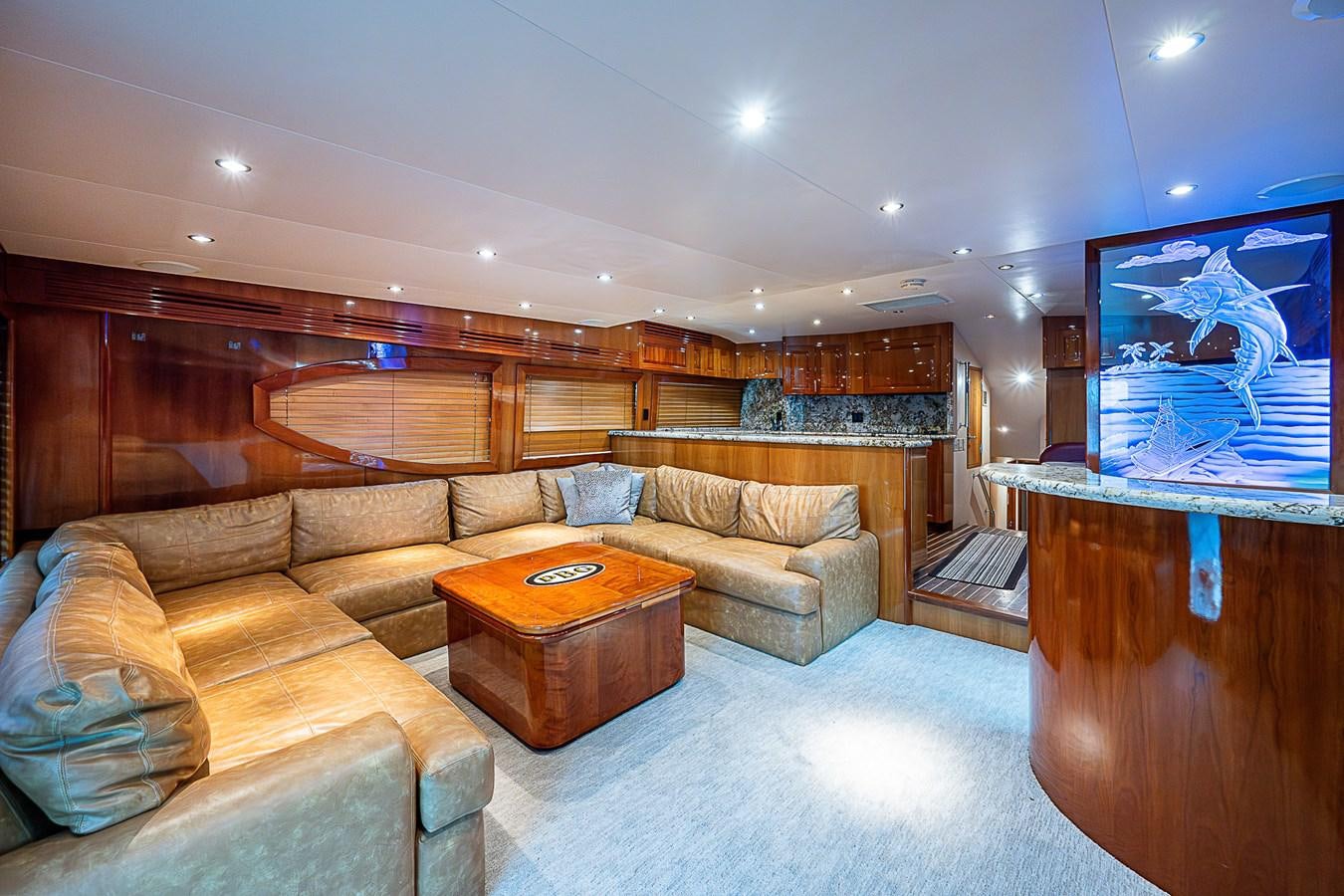 a living room with a couch and a tv aboard INSTIGATOR Yacht for Sale