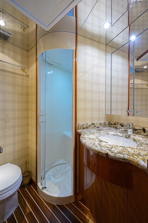 a bathroom with a shower and sink aboard INSTIGATOR Yacht for Sale