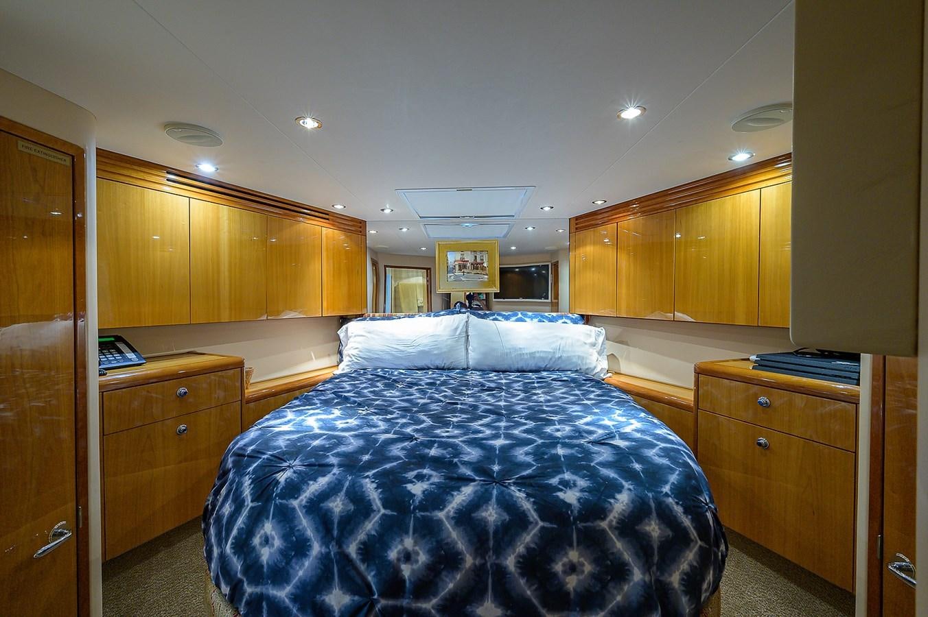 a bedroom with a large bed aboard INSTIGATOR Yacht for Sale