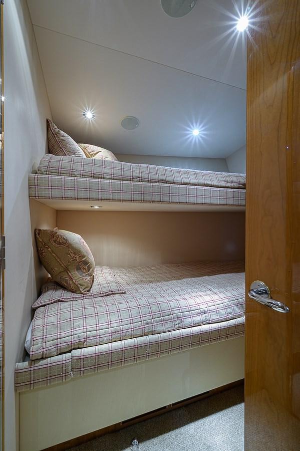 a bed with a pillow and a pillow on it aboard INSTIGATOR Yacht for Sale