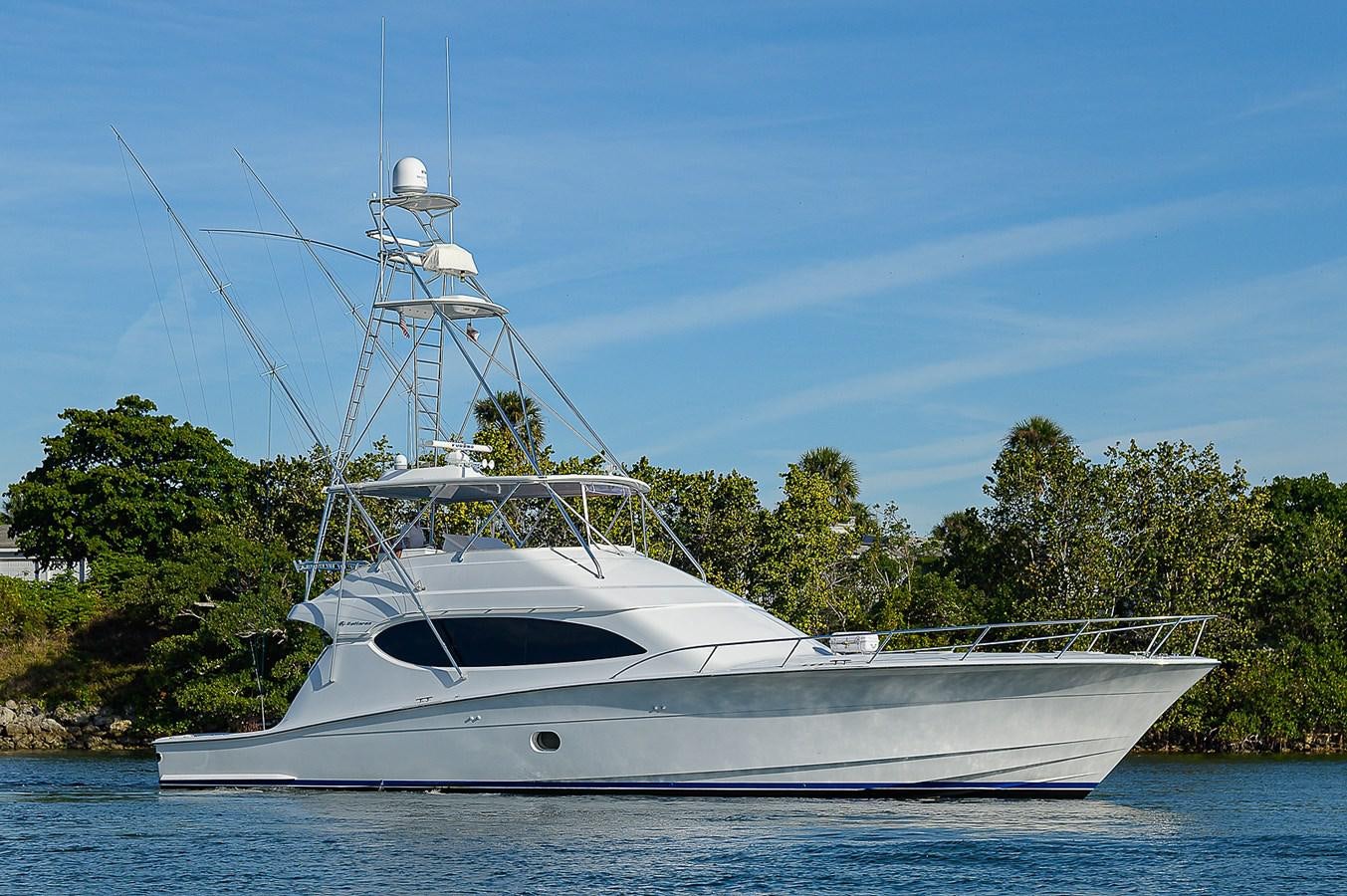 a white yacht on the water aboard INSTIGATOR Yacht for Sale