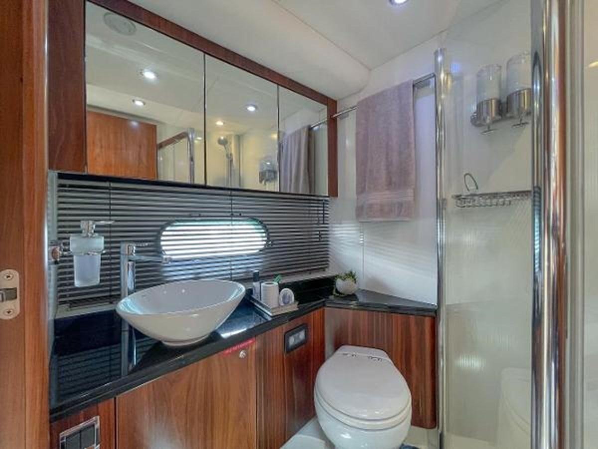 a bathroom with a sink and a toilet aboard TWINS Yacht for Sale